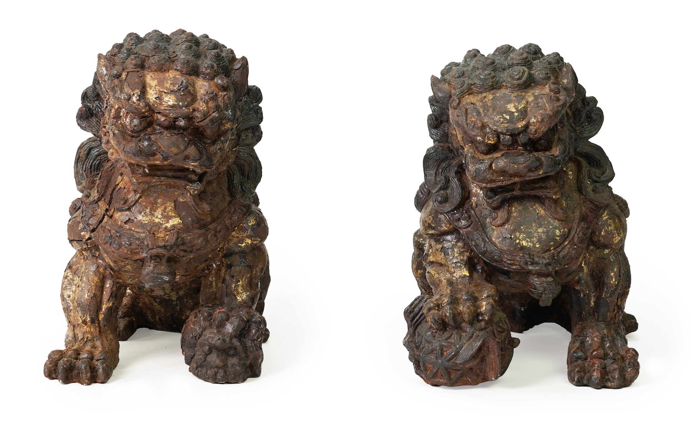A pair of large Chinese polychrome lacquered cast iron models of lion temple guardians, Qing dynasty